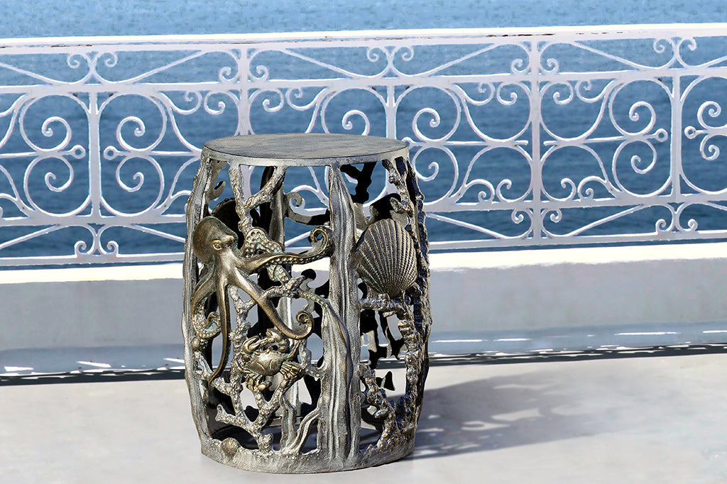 cast metal sea creature, octopus, crab, and shell detailing on stool