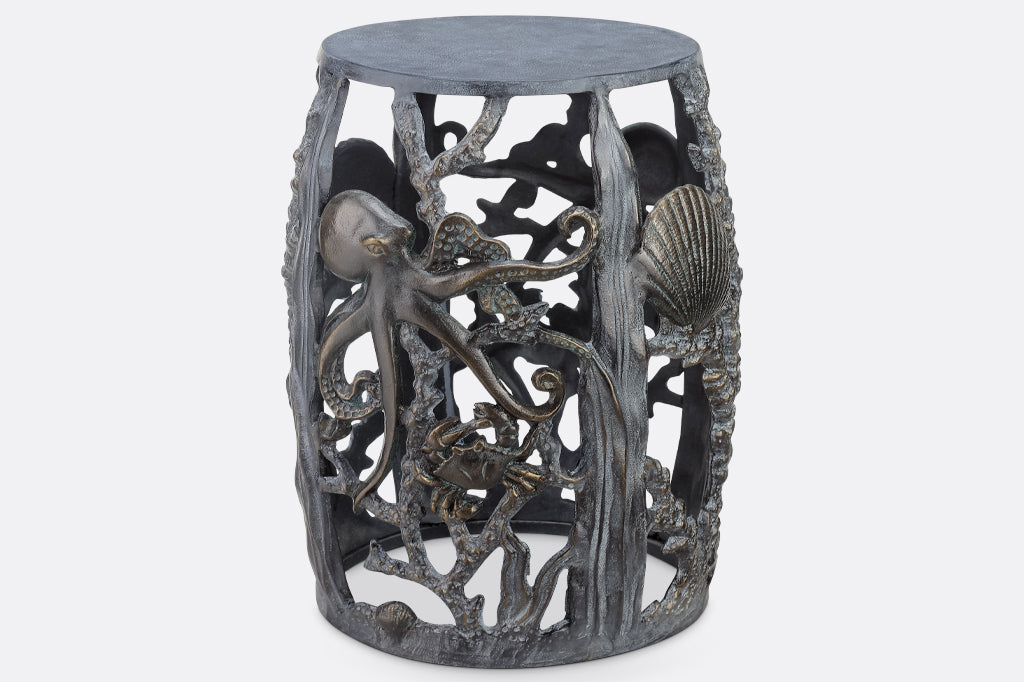 cast metal sea creature, octopus, crab, and shell detailing on stool