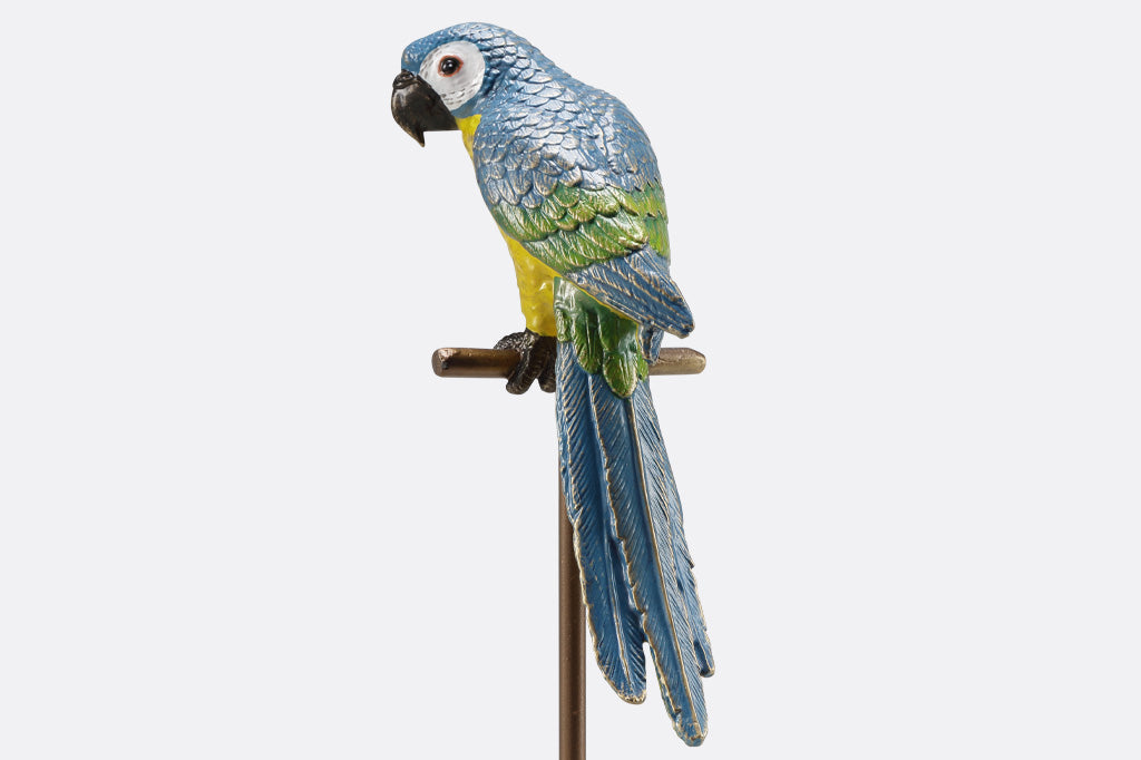 blue and yellow parrot sculpture