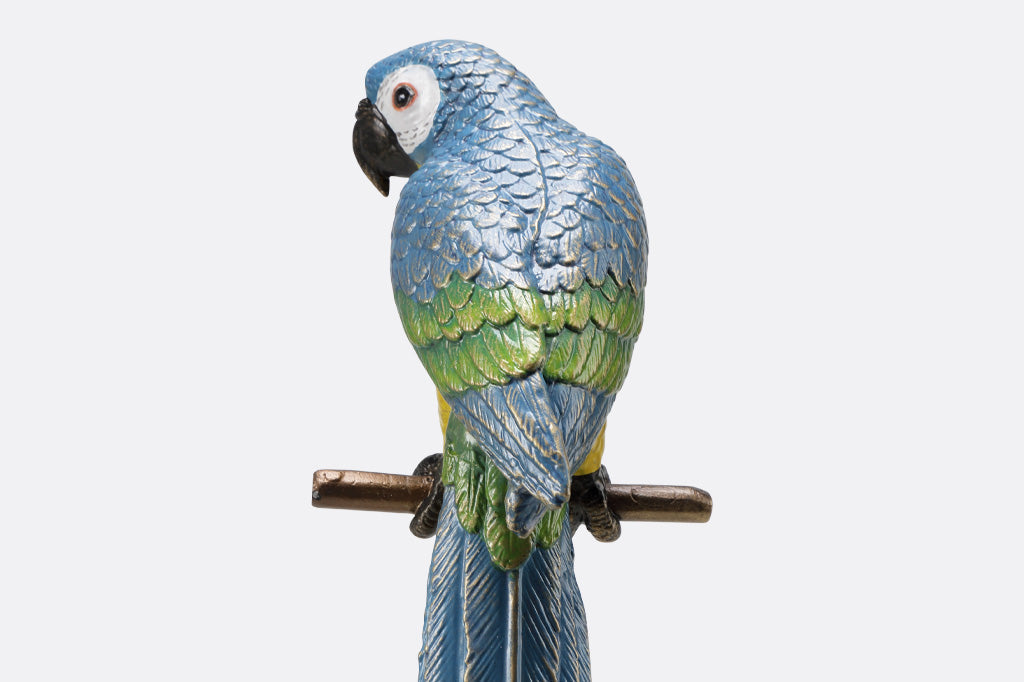 blue and yellow parrot sculpture