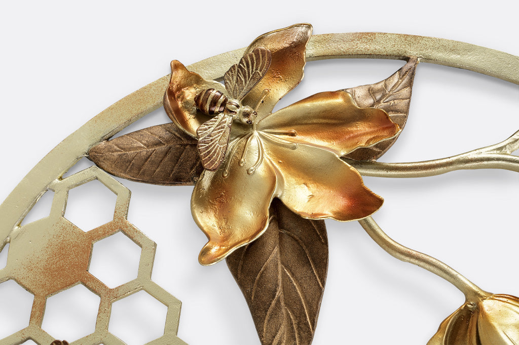 closeup view of sculpted bee and flower