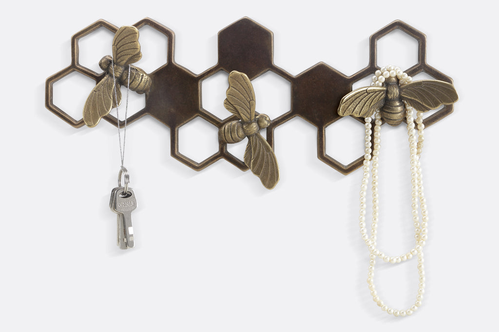 Brass wall art key hook showing honeycomb and bee motif - bee hooks hold keys and necklace