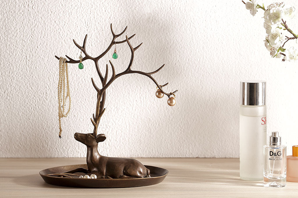 jewelry tray with resting deer and antlers designed to hold rings and necklaces