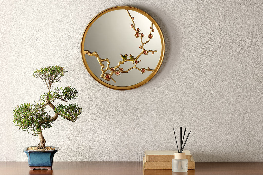 cast metal gold mirror with blossom branches and pink blooms and two small birds on branch