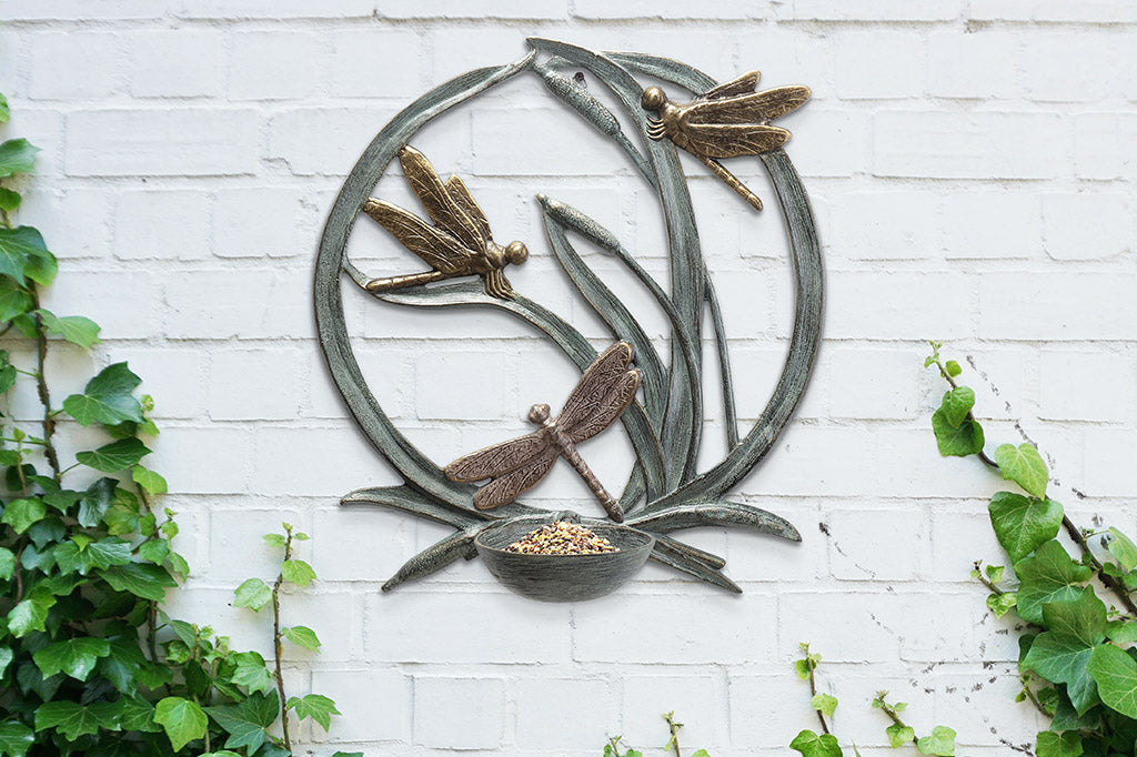 birdfeeder station that hangs on walls with dragonfly and cattail motif