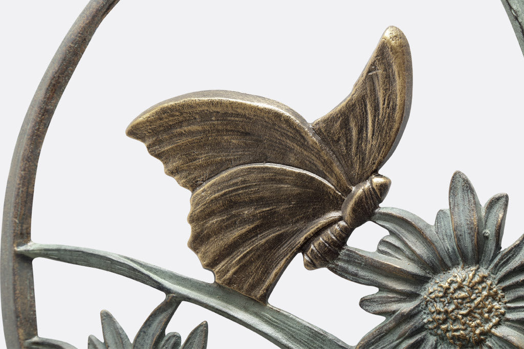 close up detail of butterfly on the wall mounted birdfeeder