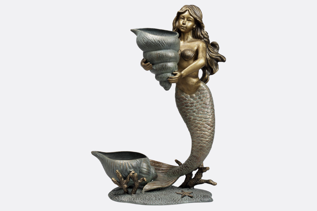 double garden planter sculpture of mermaid holding a shell; large shell at her tail fin