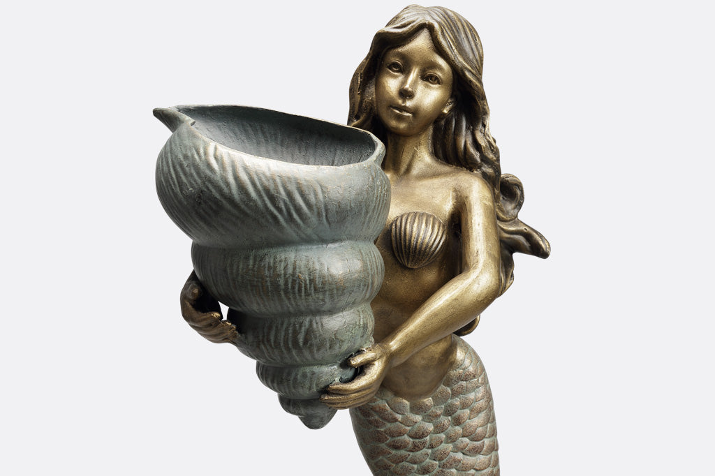 double garden planter sculpture of mermaid holding a shell