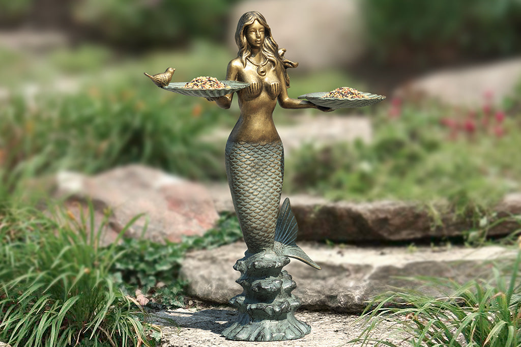 mermaid holding two shells with little bird on edge cast metal birdfeeder