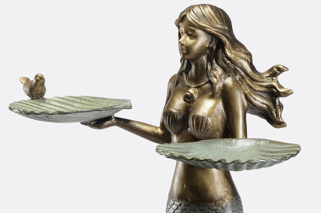 mermaid holding two shells with little bird on edge cast metal birdfeeder
