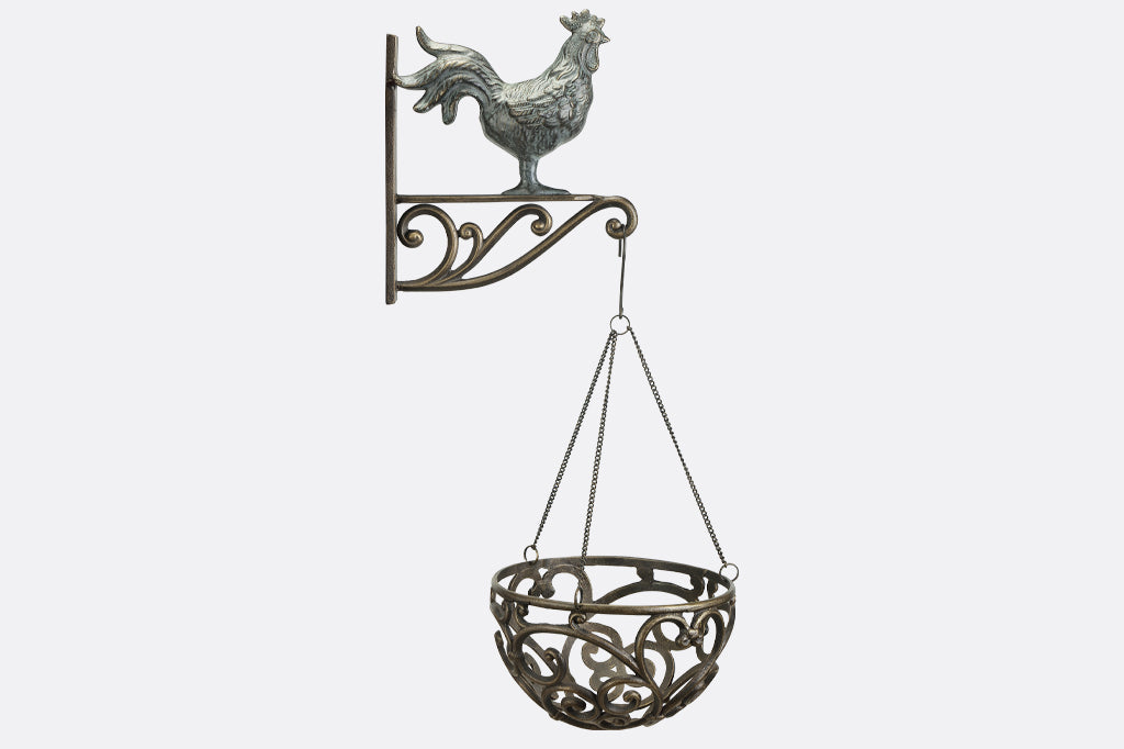 hanging planter basket suspended from rooster shaped wall hanger