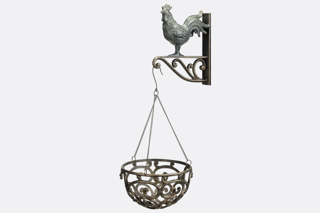 hanging planter basket suspended from rooster shaped wall hanger