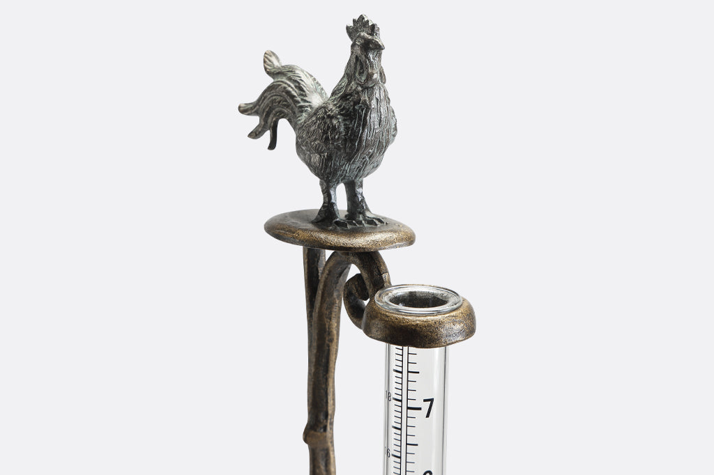 Rooster finial on staked rain catcher