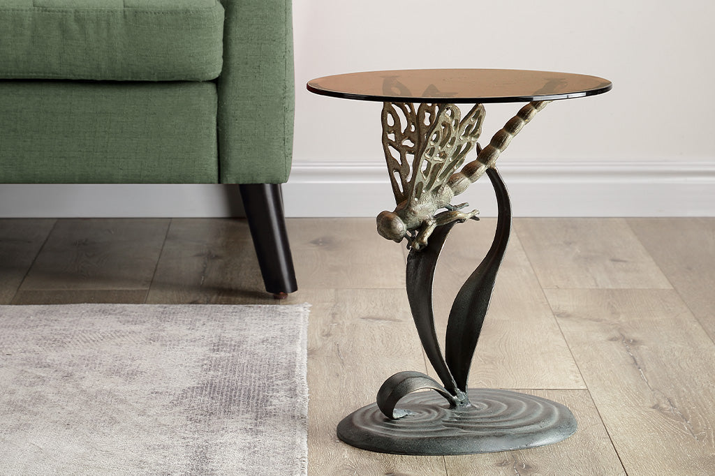 cast metal dragonfly accent table with glass top