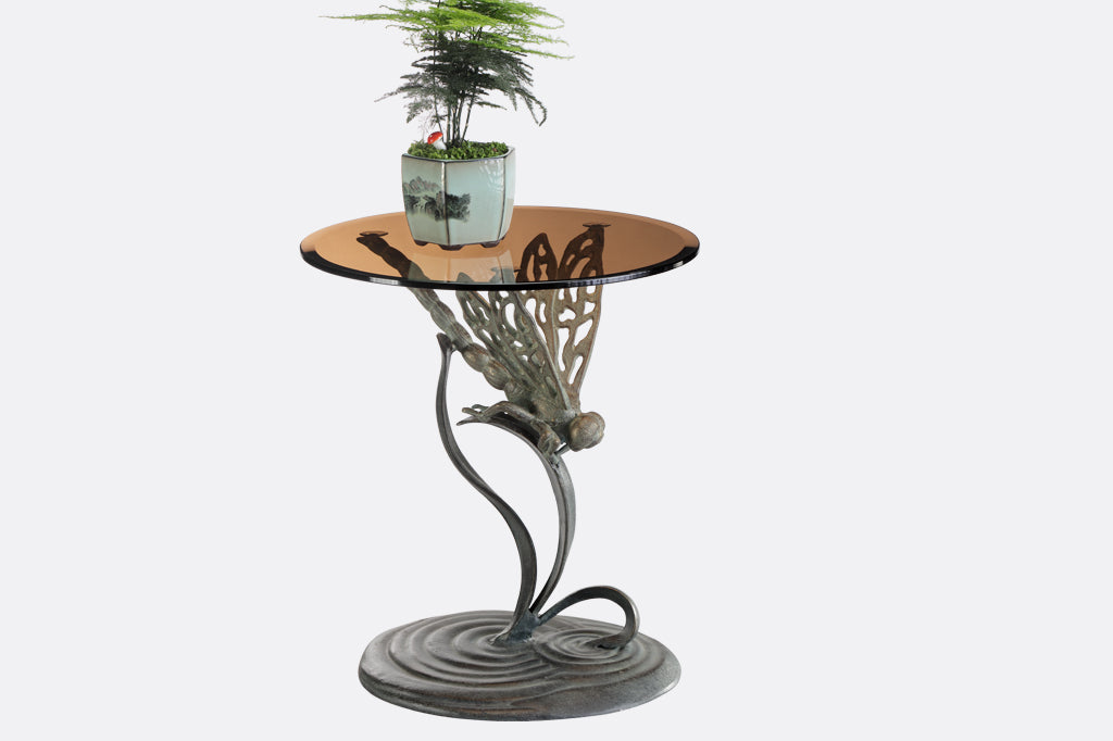 cast metal dragonfly accent table with glass top
