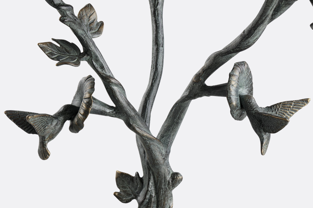close-up view of sculpted hummingbirds on the Hummingbird and Flowers Birdbath
