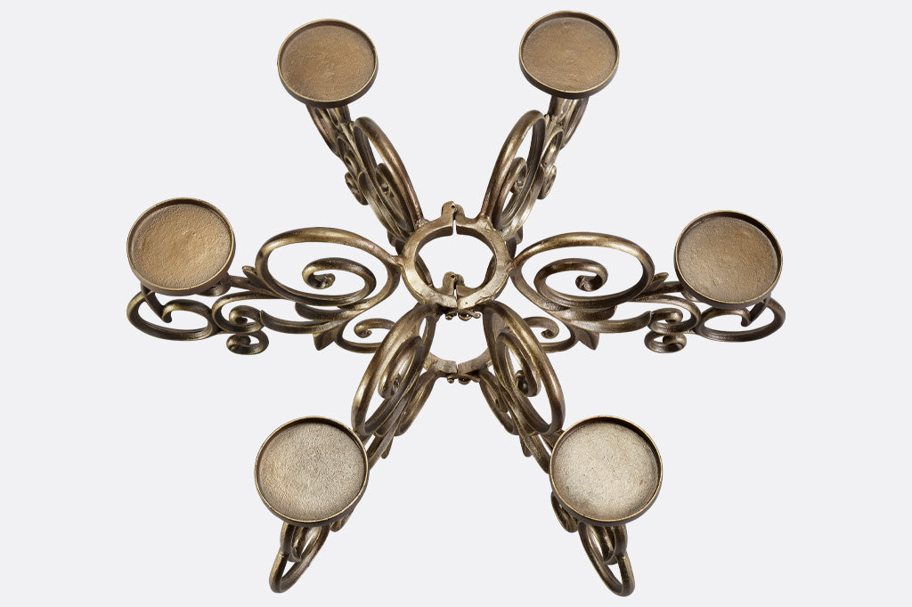top view of scrollwork candelabra designed to fit around patio table umbrella pole
