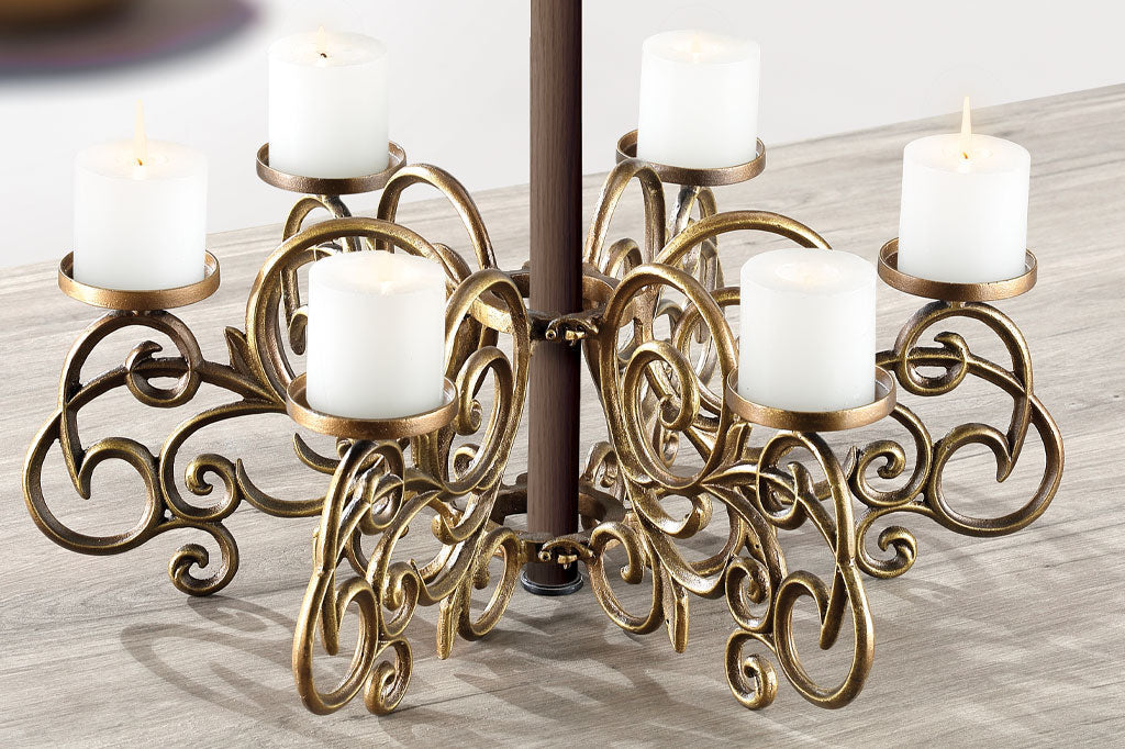scrollwork candelabra designed to fit around patio table umbrella pole - shown with 6 lit candles on table