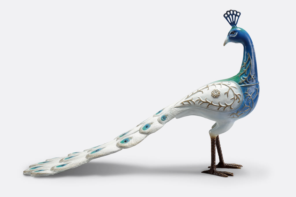 white and blue peacock sculpture