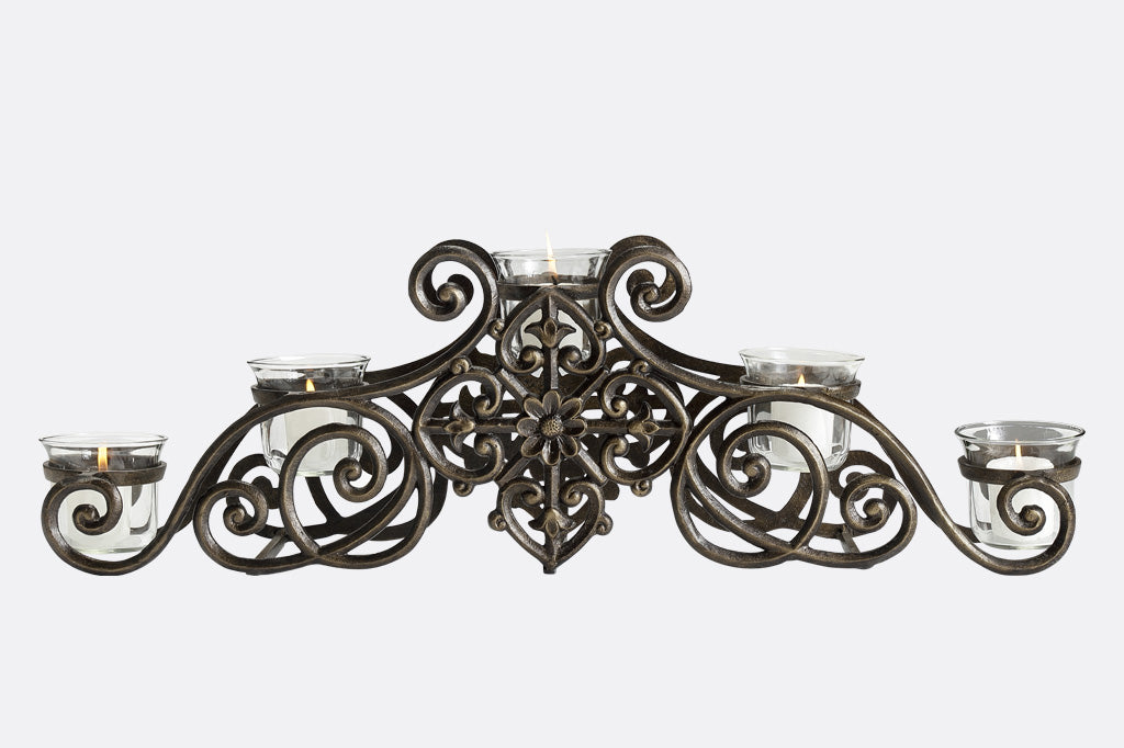 scrollwork candelabra that holds 5 votive candles in glass cups
#color_bronze