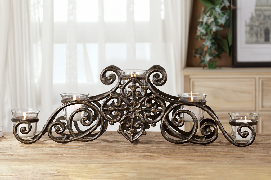 scrollwork candelabra that holds 5 votive candles in glass cups
#color_bronze