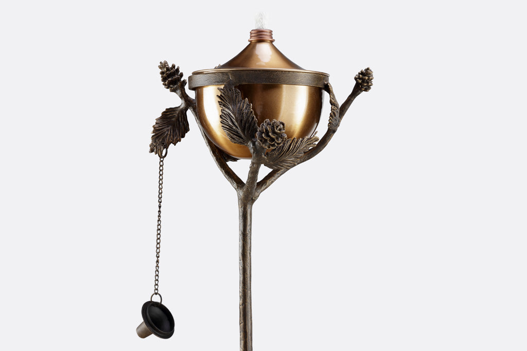 Aspen Oil Torch with pinecone and branch motif