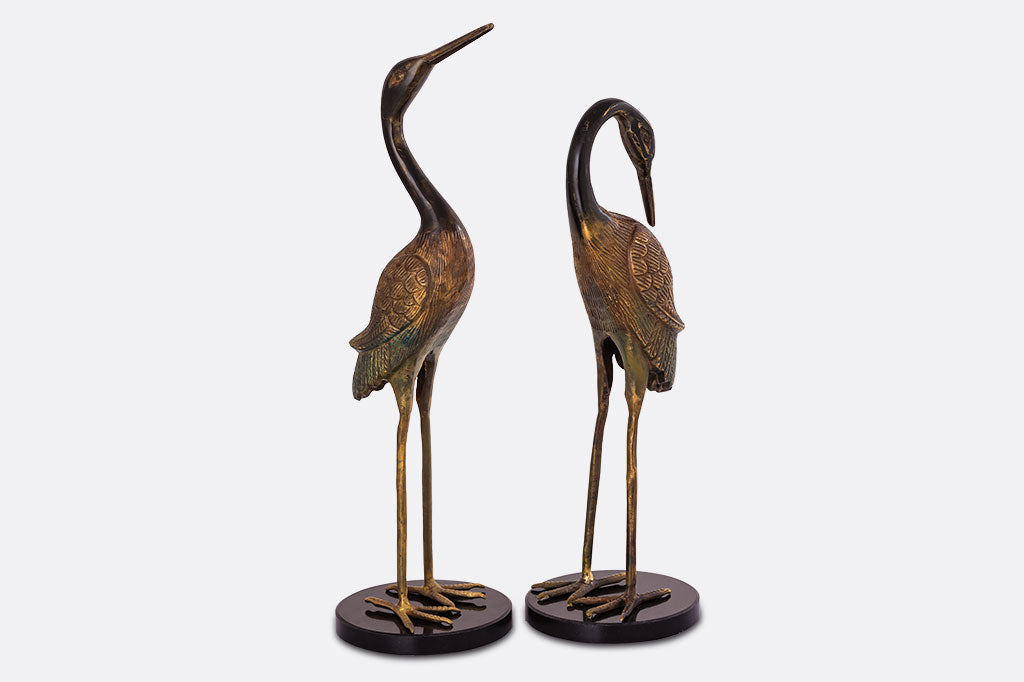 pair of crane table sculptures with marble base