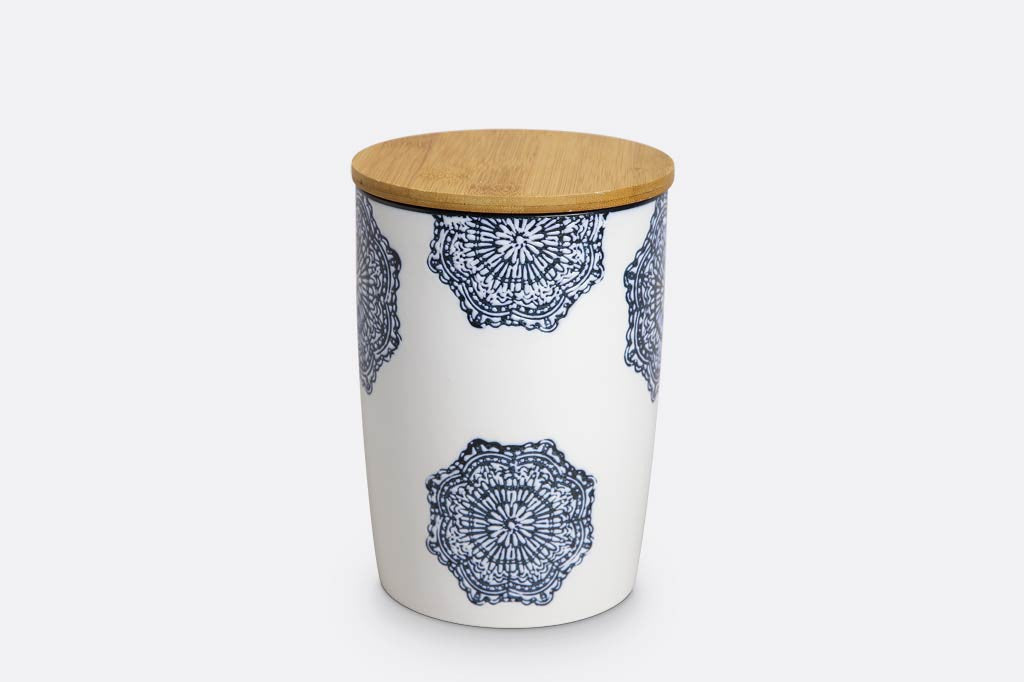 white ceramic canister with wood lid; blue mediterranean glazed print and blue rim