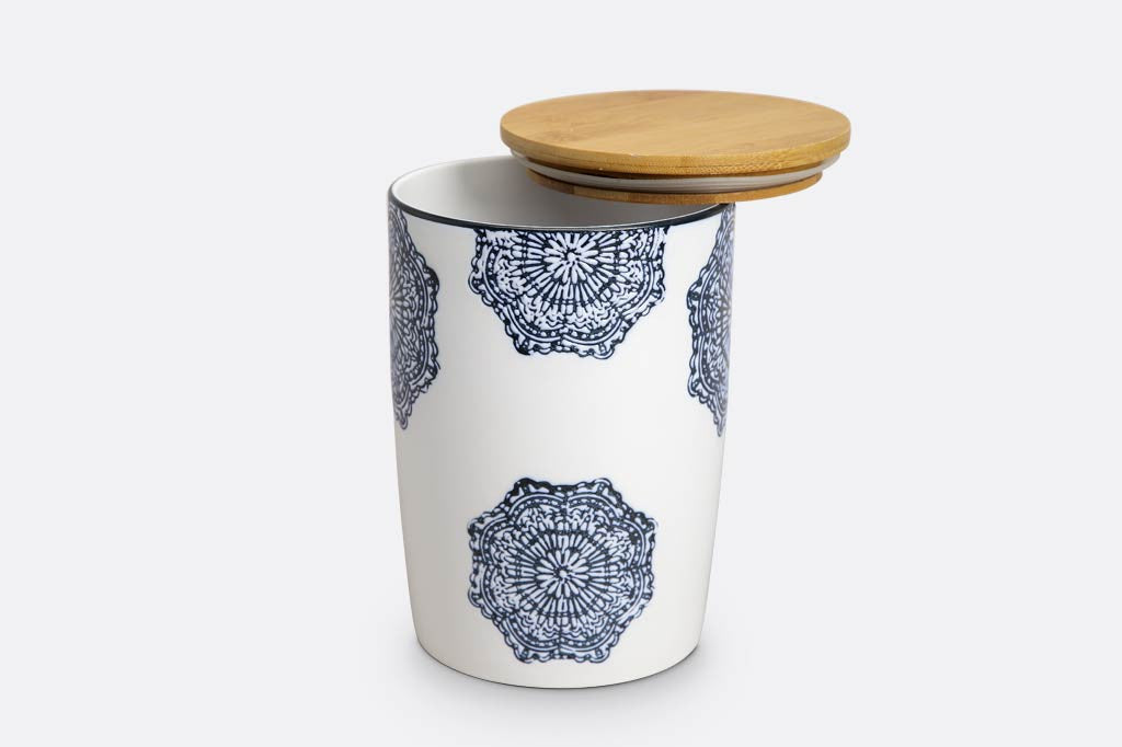 white ceramic canister with wood lid; blue mediterranean glazed print and blue rim