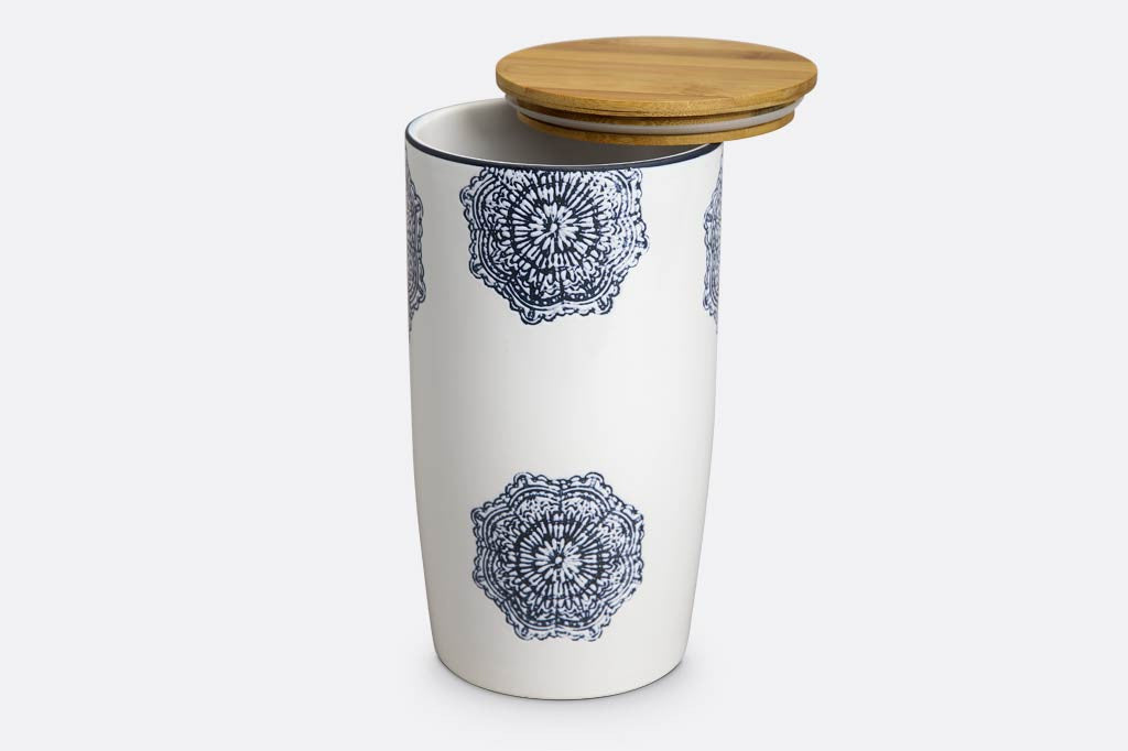 white ceramic canister with wood lid; blue mediterranean glazed print and blue rim