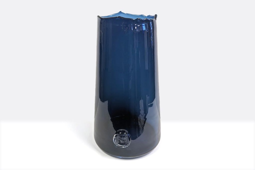 deeply saturated glass vase in rich blues; heavy glass with makers mark impression, wavy rim - reminescent of ocean waves