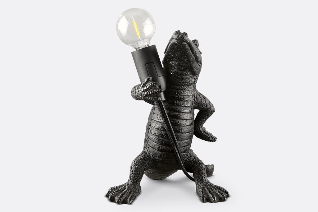 novelty desk lamp, resin alligator holding lightbulb - front view