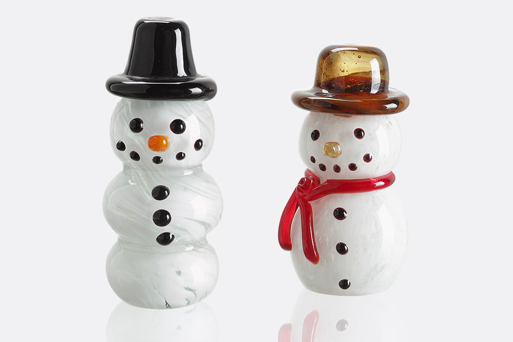 two glass snowmen in different hats. one with red scarf 
