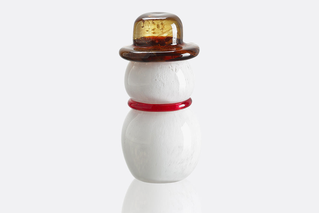 Small glass snowman figurine with a brown top and red band on a white background