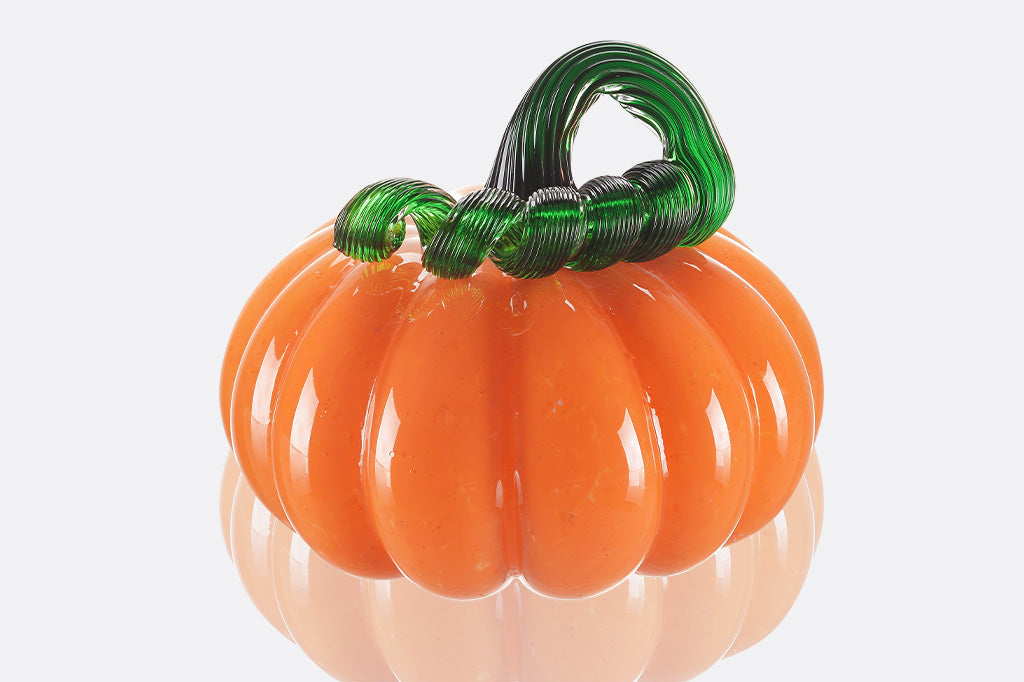 glass pumpkin with curly green stem