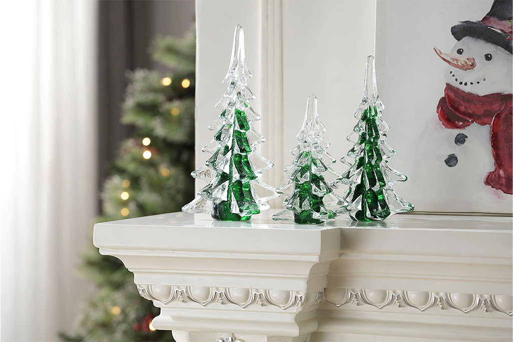 Set of 3 glass trees used as a holiday shelf decoration in a Christmas scene