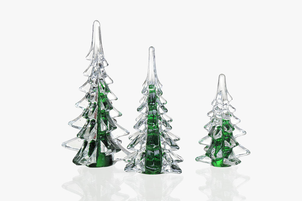 Studio shot of 3 glass trees in green and clear glass