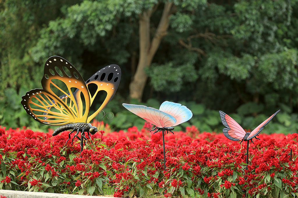 A collection of butterfly garden stakes in different colors and sizes.