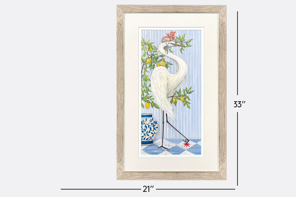 Framed artwork of cranes wearing crowns made of coral next to fruit trees.