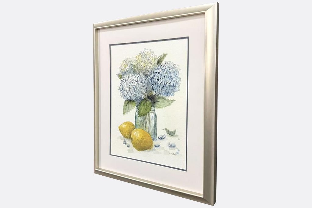 Framed artwork of hydrangeas and lemons