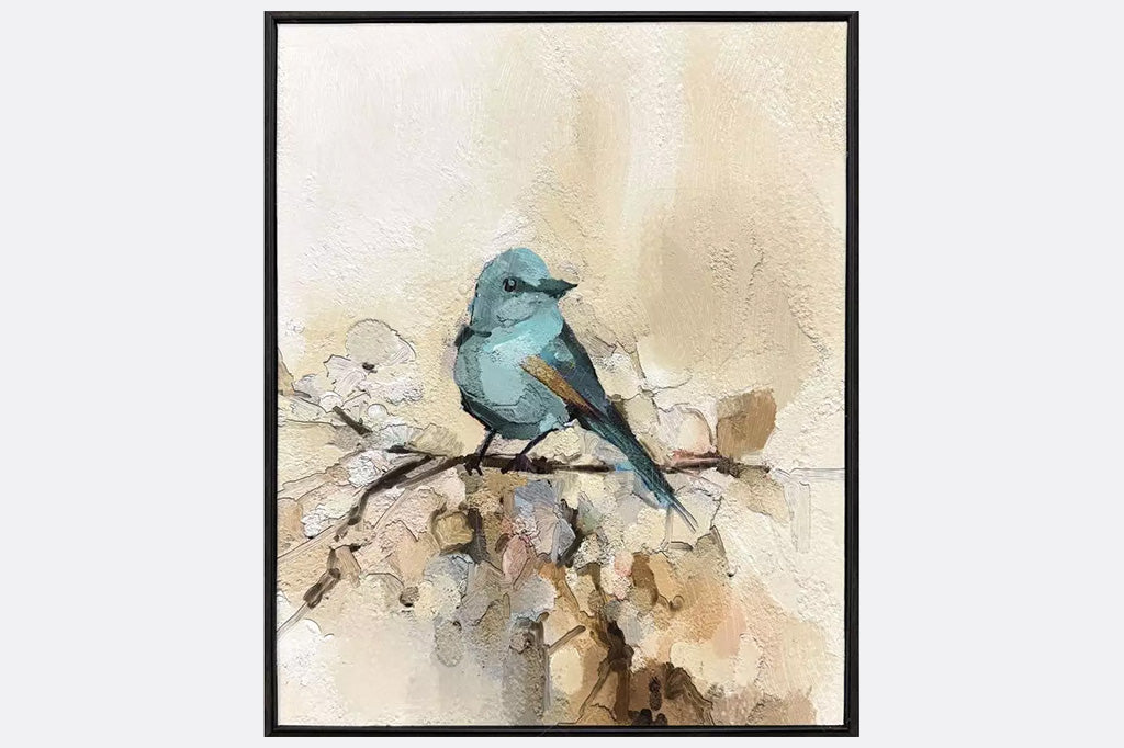 Two framed artworks of blue birds on a branch.