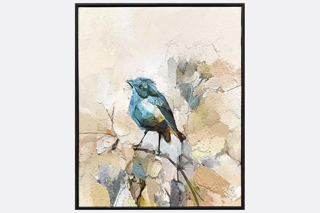 Two framed artworks of blue birds on a branch.