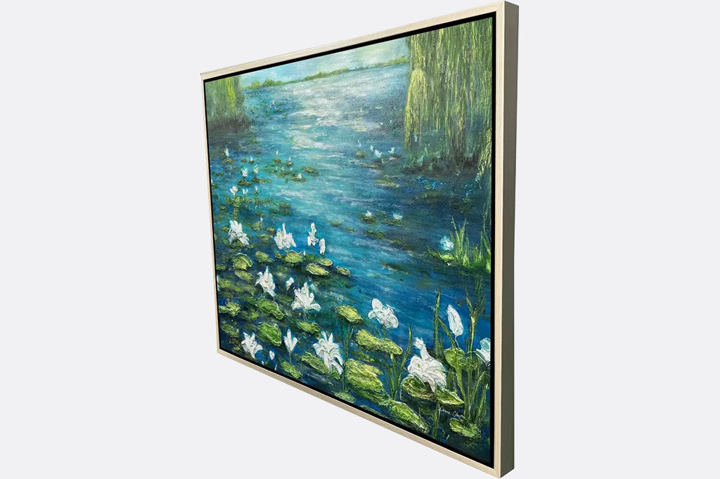 Framed artwork of a lily pond scene with white flowers and green lily pads.
