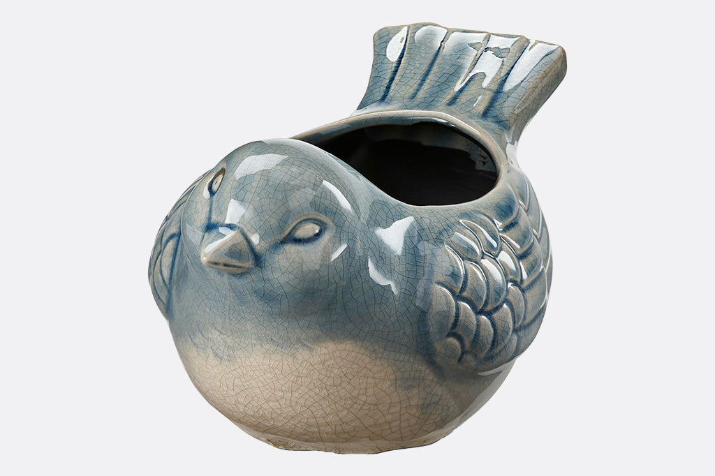 Bluebird Shaped ceramic planter in glossy crackle glaze of cream and watery blue. 
