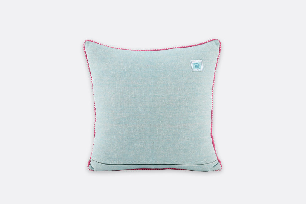 Light blue pillow with pink trim on a white background