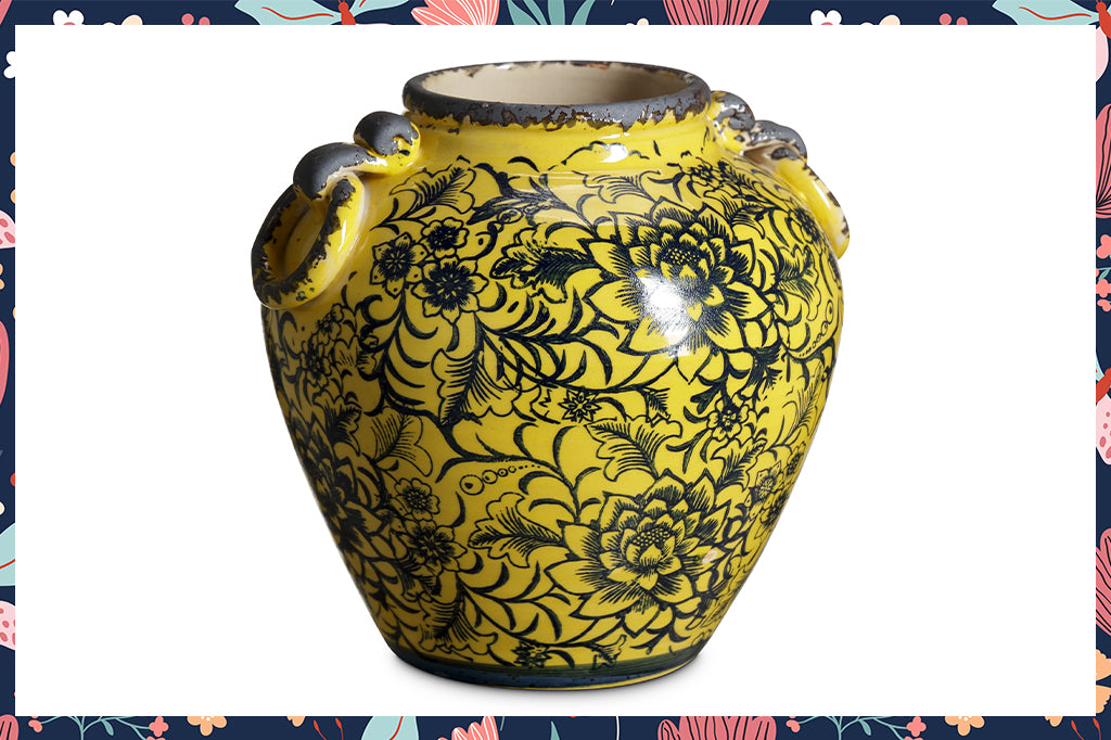 bright yellow with navy blue floral motifs ceramic vase