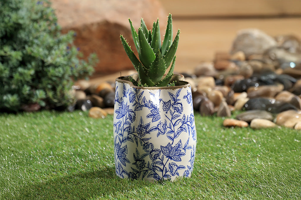 A white vase with blue floral patterns
