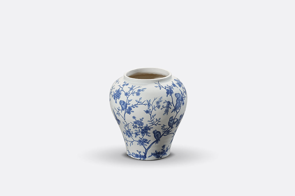 A white and blue Chinoiserie vase with bluebirds and branches