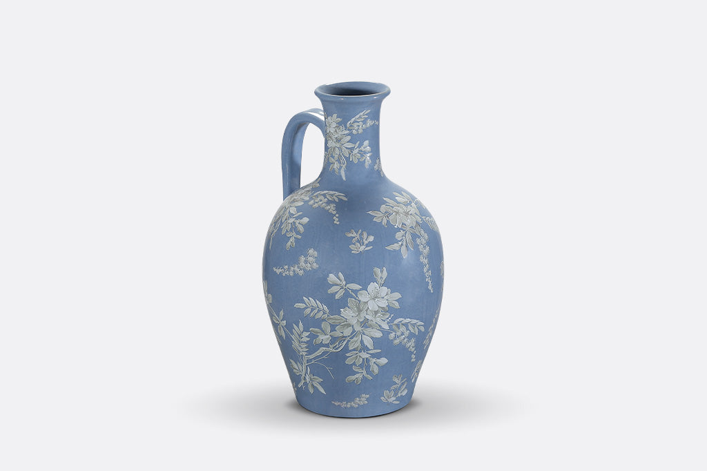 A blue jug ewer a white cornflower design.