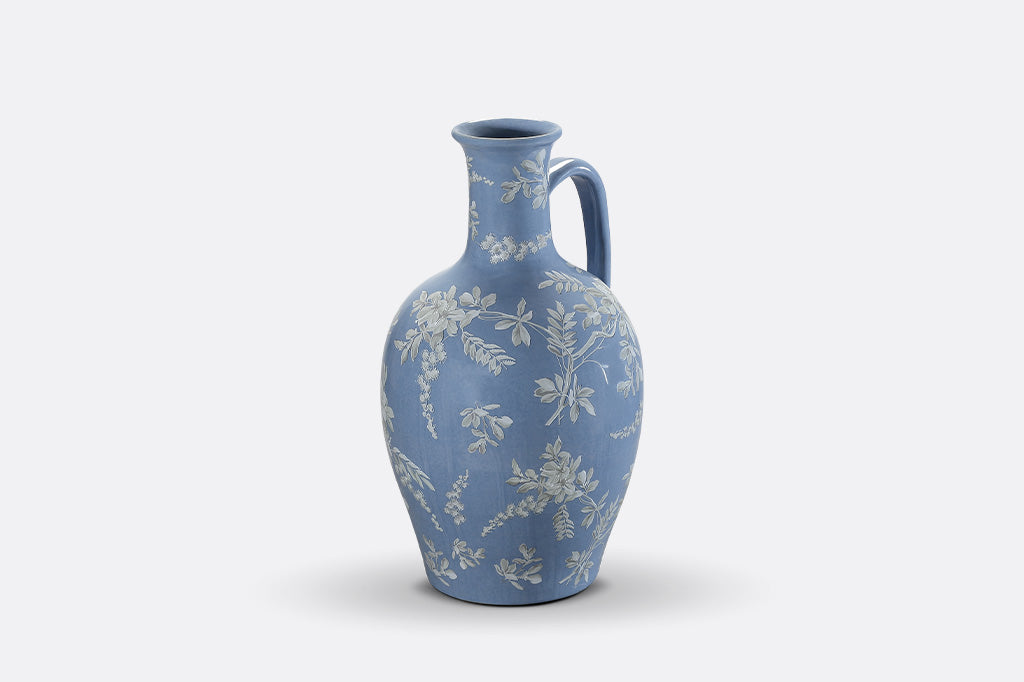A blue jug ewer a white cornflower design.